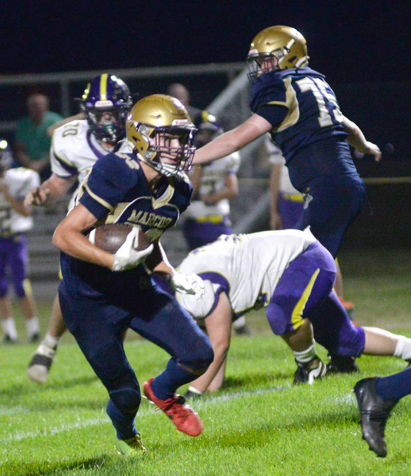 Polo's Mercer Mumford (83) runs with the ball against Orangeville at Polo High School on Friday, Oct. 3, 2025