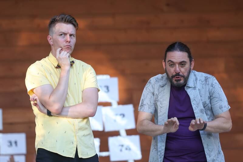 GreenRoom Improv cast members Christian Zierke, left, and Sam Barbaro do a murder scene improv for the improv show hosted by the Morris Library at Goold Park on Friday, Aug. 11, 2023 in Morris.