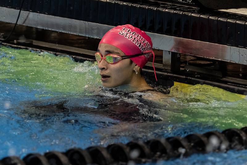 Plainfield’s Mia Ceballos looks at the board after competing in the 200 Yard Freestyle Relay during the IHSA Girls State Swimming Preliminaries at FMC Natatorium in Westmont on Nov. 14, 2025.