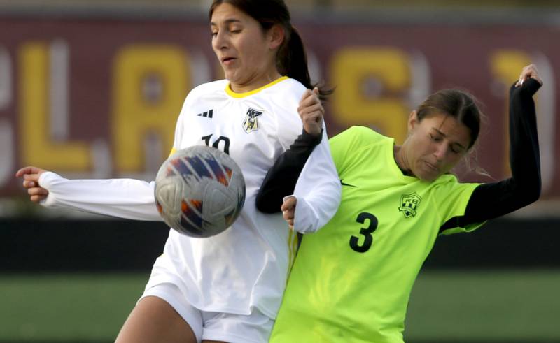 Harvard's Jackie Silva battles with Richmond-Burton's McKenzie Ragusca for control of the ball during the Kishwaukee River Conference Girls Soccer Tournament Championship Match on Wednesday, May 7, 2025, at HRichmond-Burton High School in Richmond.