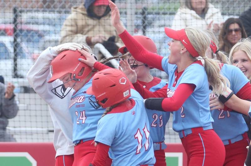 Ottawa's Bobbi Snook (left) is greeted by teammates after hitting a two-run homerun against L-P on Monday, April 21, 2025 at the L-P Athletic Complex in La Salle.