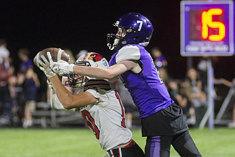 Stillman Valley’s Keaton Rauman intercepts a pass in front of Dixon’s Ethan Hays Friday, Sept. 16, 2022.