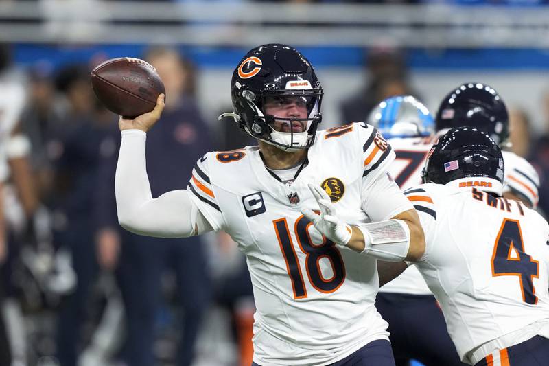 Chicago Bears quarterback Caleb Williams (18) throws against the Detroit Lions during the first half of an NFL football game, Sunday, Nov. 17, 2024, in Detroit.