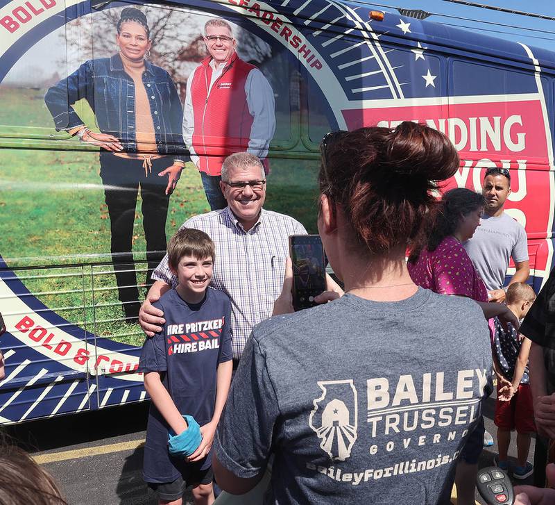 Darren Bailey, a Republican candidate for Illinois governor, poses for a photo for supporters Friday, June 17, 2022, during his campaign stop at Tom and Jerry's in Sycamore. Bailey is currently on a bus tour across the state that will cover 102 countys in 14 days.