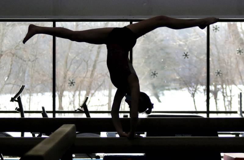 A member of the DeKalb-Sycamore co-op gymnastics team practices Wednesday at Energym in Sycamore.