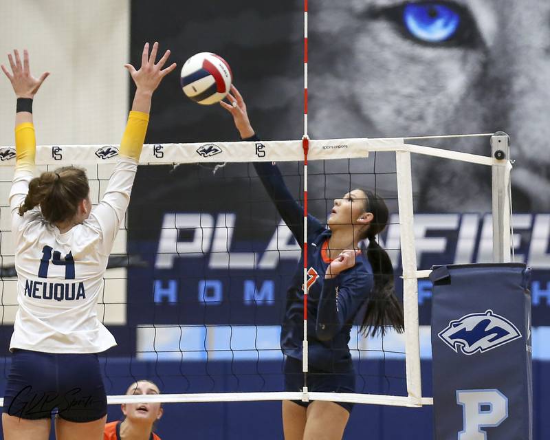 Oswego's Hannah Herrick (7) taps the ball over the net during Class 4A Regional Final volleyball match between Neuqua Valley at Oswego. Oct 30, 2025 in Plainfield.
