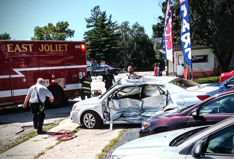 An emergency crew with East Joliet Fire Protection District responds to a deadly crash on Wednesday, Aug. 31, 2022, in Joliet Township. Illinois State Police identified the driver who died as Michael Langlois, 56, of New Lenox.