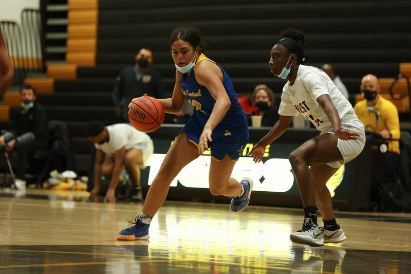 Joliet Central’s Joyce Tua-Link drives to the basket against Joliet West. Tuesday, Feb. 8, 2022, in Joliet.