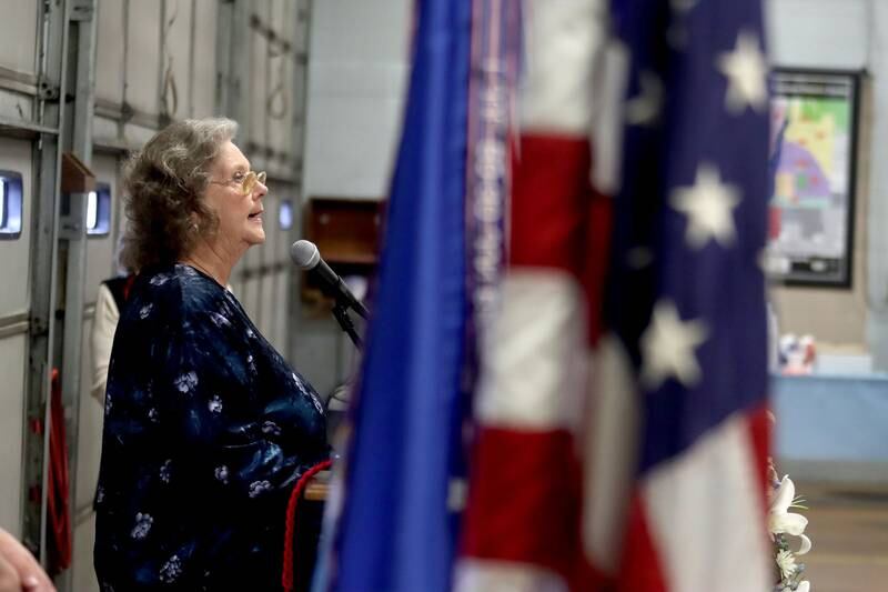 Marcia Jarecki of Frankfort speaks as a remembrance was held Saturday at Wonder Lake Fire Protection District Station 2 on the 40th anniversary of a midair military jet explosion that happened over the small, rural area northeast of Woodstock. Her husband Kenneth J Jarecki and 26 others died.