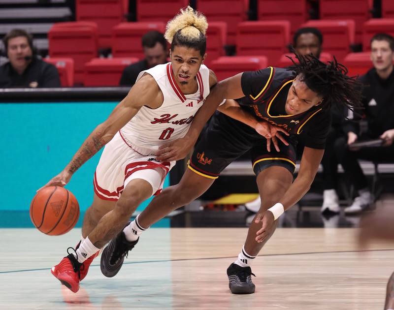 Northern Illinois' guard Gianni Cobb drives against Louisiana-Monroe defender Monday, Nov. 3, 2025, during their game at the Convocation Center at NIU in DeKalb.