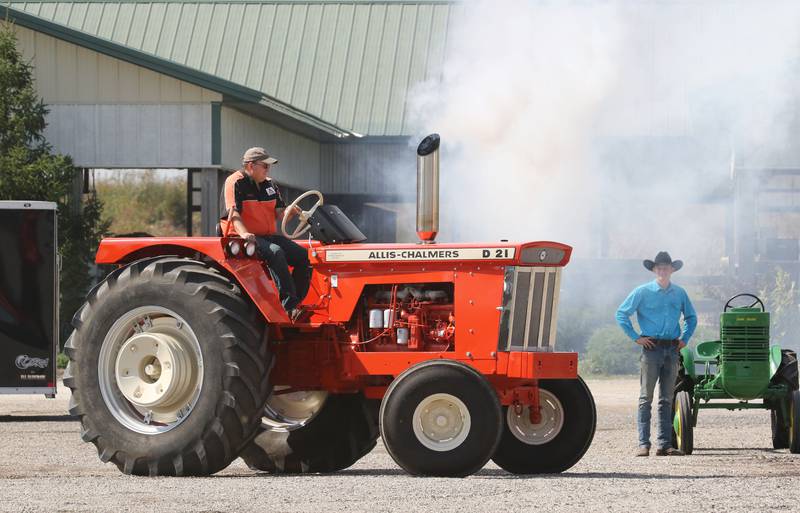 John Dilg, of Pleasant Prairie, Wis., drives his 1967 Allis-Chalmers D21 tractor past Justin Oechsle, of Grayslake during the Lake County Farm Heritage & Harvest Festival at the Lake County Fairgrounds on September 23rd in Grayslake. The festival was sponsored by the Lake County Farm Heritage Association.
Photo by Candace H. Johnson for Shaw Local News Network