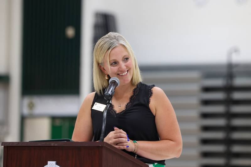 Bishop McNamara principal Kaelyn Bess smiles as she speaks during the ribbon-cutting ceremony for the new Rich Zinanni Athletic Complex on Thursday, Aug. 21, 2025.