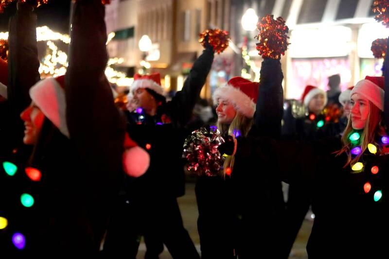 A group from Crystal Lake Central marches during the Festival of Lights Holiday Parade in downtown Crystal Lake on Friday, Nov. 29, 2024.