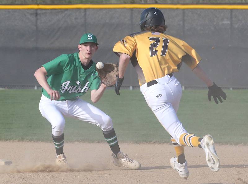 Seneca's Calvin Maierhofer makes a catch at second base to tag out Putnam County's Troy Petty on Thursday, April 13, 2023 at Seneca High School.