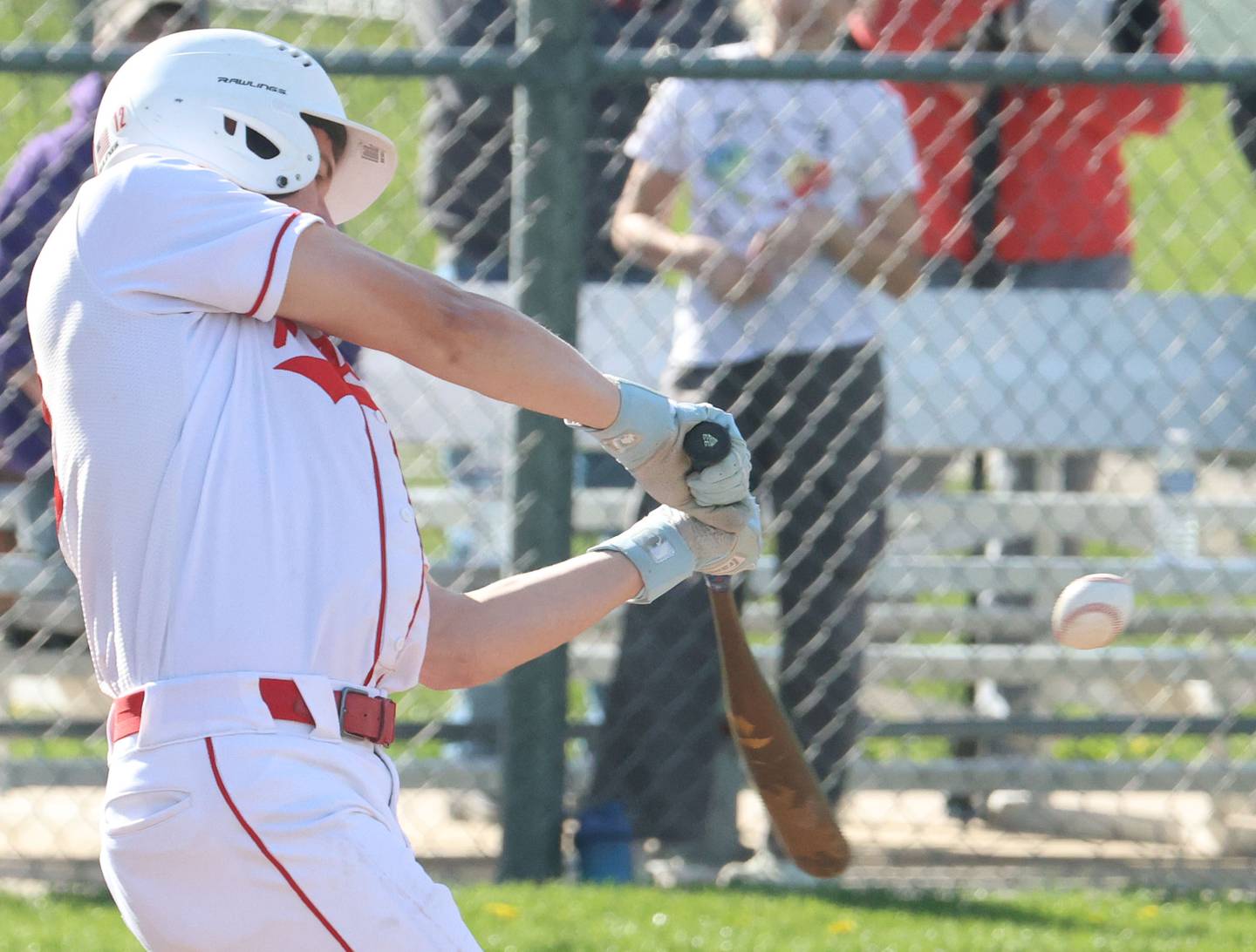 Ottawa's Jack Carroll connects with a swing Monday, April 20, 2026, while playing Morris at King Field in Ottawa.