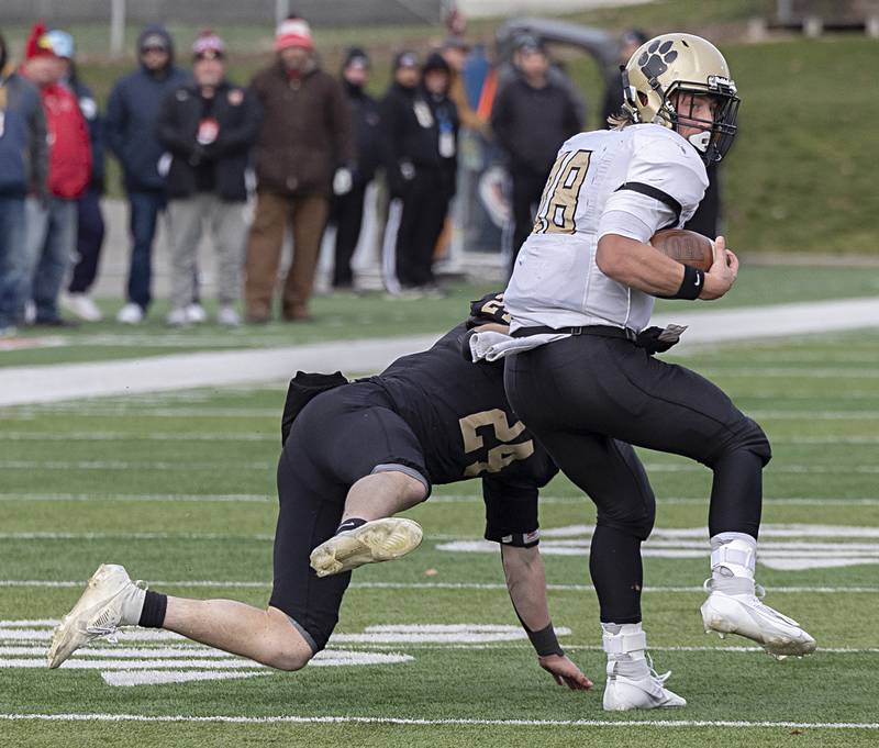 Camp Point's Gavin Blewett spins away from Lena-Winslow's Lucas Fye for yardage Friday, Nov. 24, 2023 in the 1A state football championship game at Hancock Stadium in Normal.