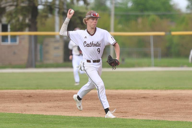 Joliet Catholic’s Cody Busch makes a throw to first for the out against Nazareth on Wednesday, April 29, 2026 in Joliet.