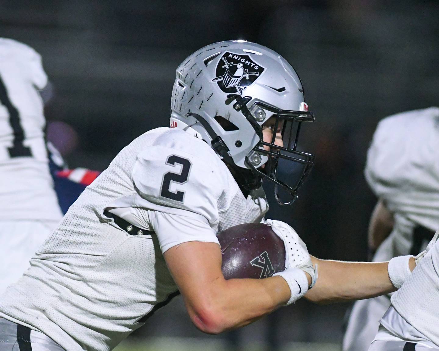 Kaneland's Dylan Sanagustin (2) runs the ball for some yards during the first week of playoffs on Friday Nov. 1, 2024, while traveling to take on Belvidere North High School.