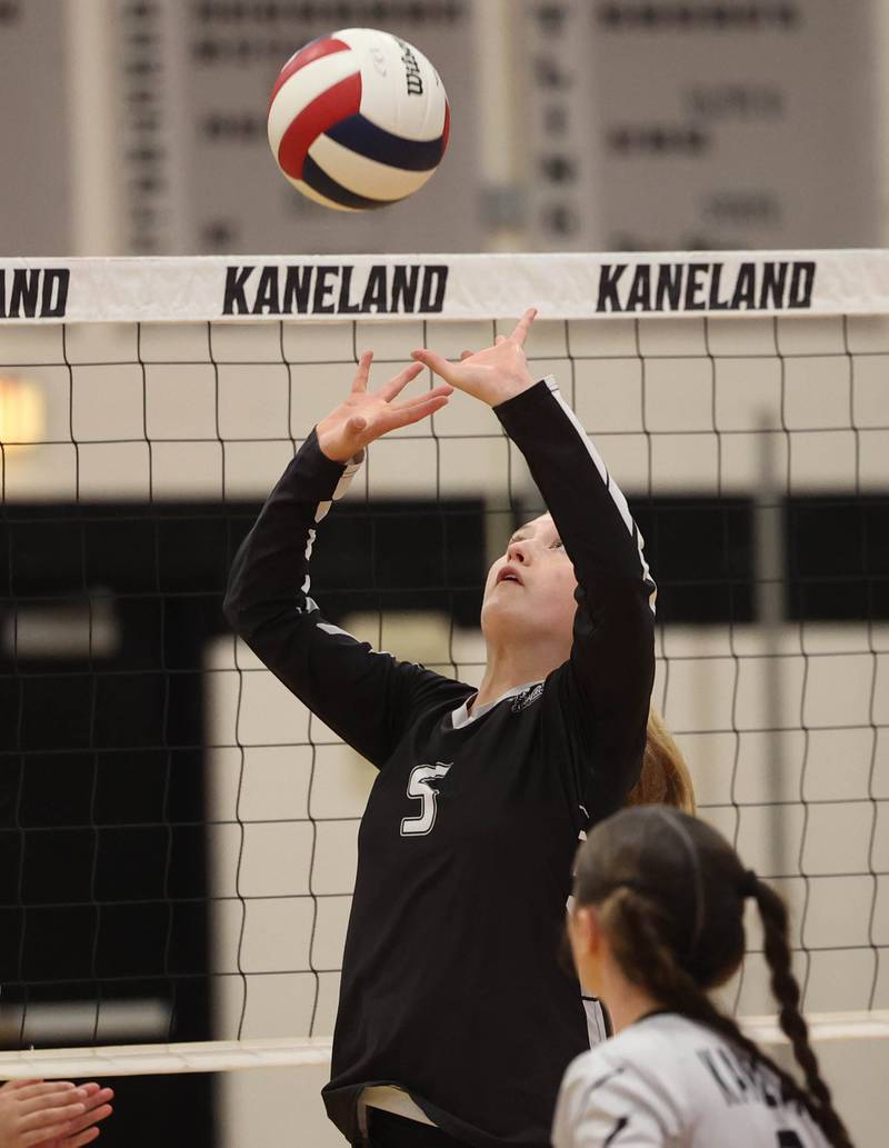 Kaneland's Abigail Carter sets the ball during their match against Sycamore Tuesday, Sept. 30, 2025, at Kaneland High School in Maple Park.