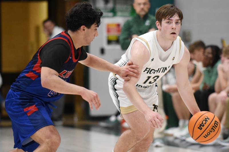 Bishop McNamara's Teddy Fogel, right, looks for an open teammate as Lycee Francais de Chicago's Jonathan Seif defends during a game at Bishop McNamara Wednesday, Feb. 18, 2026.