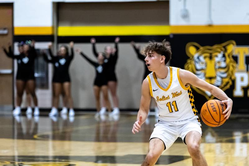 Joliet West's Luke Grevengoed scans the court during a varsity boys basketball game against Minooka at Joliet West on Jan. 6, 2026.