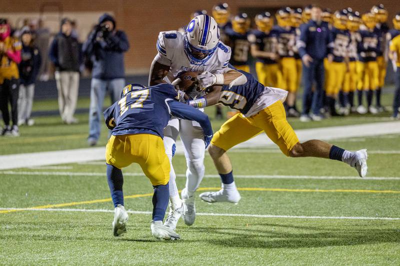 Quincy’s Tykell Hammers is stopped short of the end zone by Sterling’s Kaedon Phillips and Will Ports Friday, Oct.6, 2023 in Sterling.