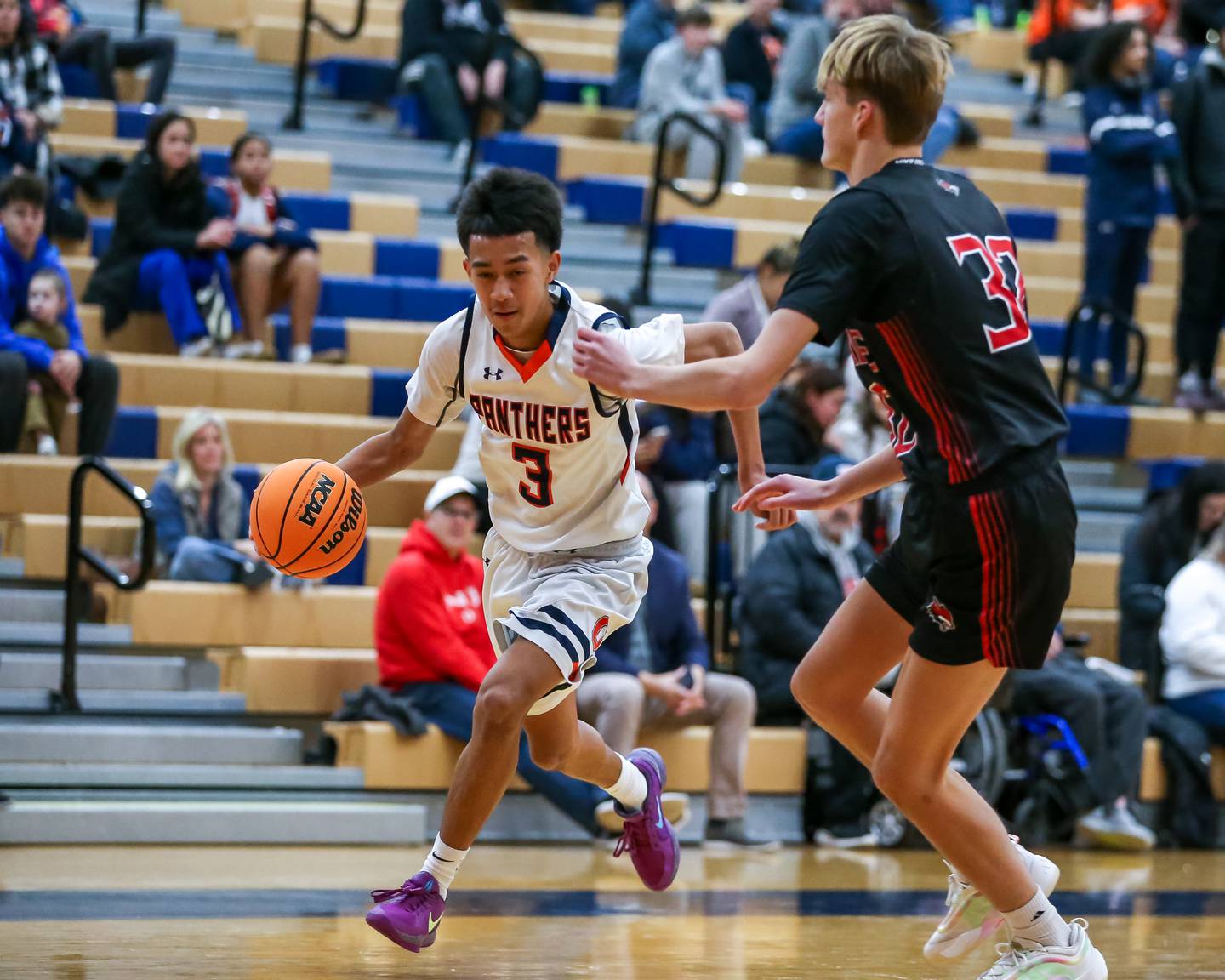 Oswego's Ethan Vahl (3) dribbles past the defense during their basketball game between Yorkville at Oswego, Tuesday Dec 10, 2024 in Oswego.