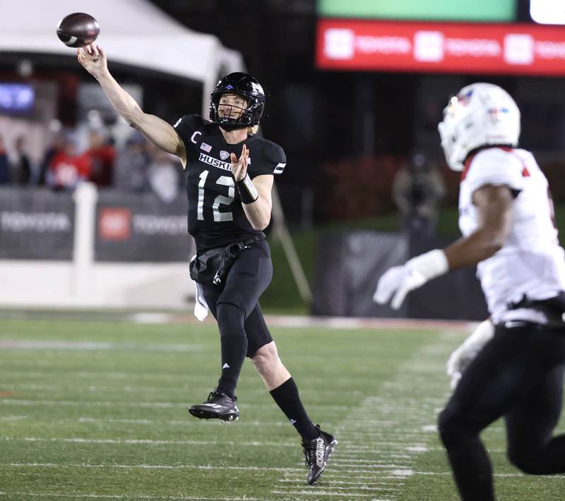Northern Illinois' Rocky Lombardi escapes the Ball State pressure and throws on the run during their game Tuesday, Nov. 7, 2023, in Huskie Stadium at NIU in DeKalb.