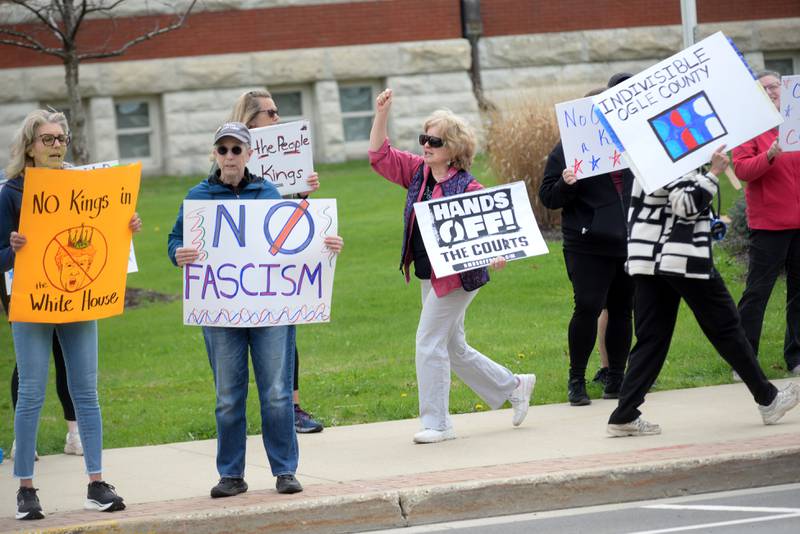 Approximately 250 people attended a Hands Off rally on Saturday, April 19, 2025 around the historic Ogle County Courthouse in Oregon. Participants carried signs critical of  the Trump administration. Saturday's rally followed an April 5 rally held at the same location.