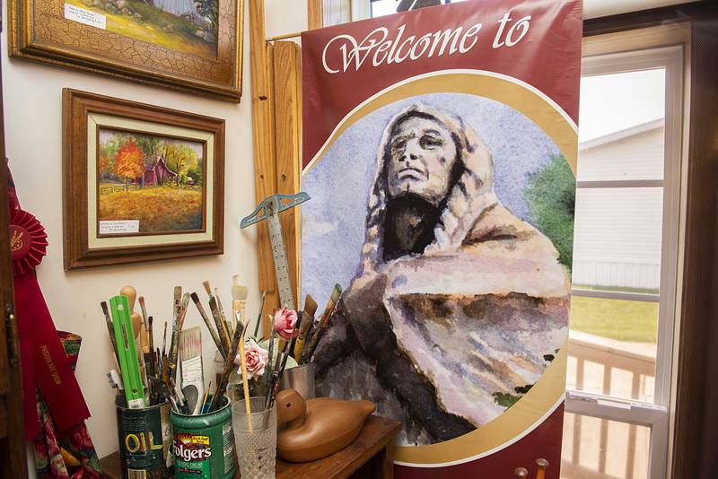The city of Oregon chose Harvey’s Blackhawk oil painting to represent the city on the downtown lights posts.