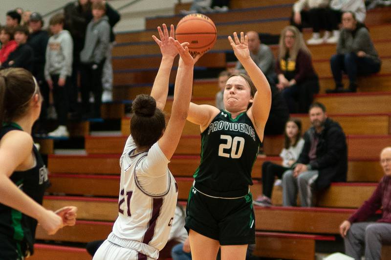 Providence's Gabi Bednar (20) shoots a three-pointer against Montini’s Alyssa Epps (21) during the 3A Glenbard South Sectional basketball final at Glenbard South High School in Glen Ellyn on Thursday, Feb 23, 2023.