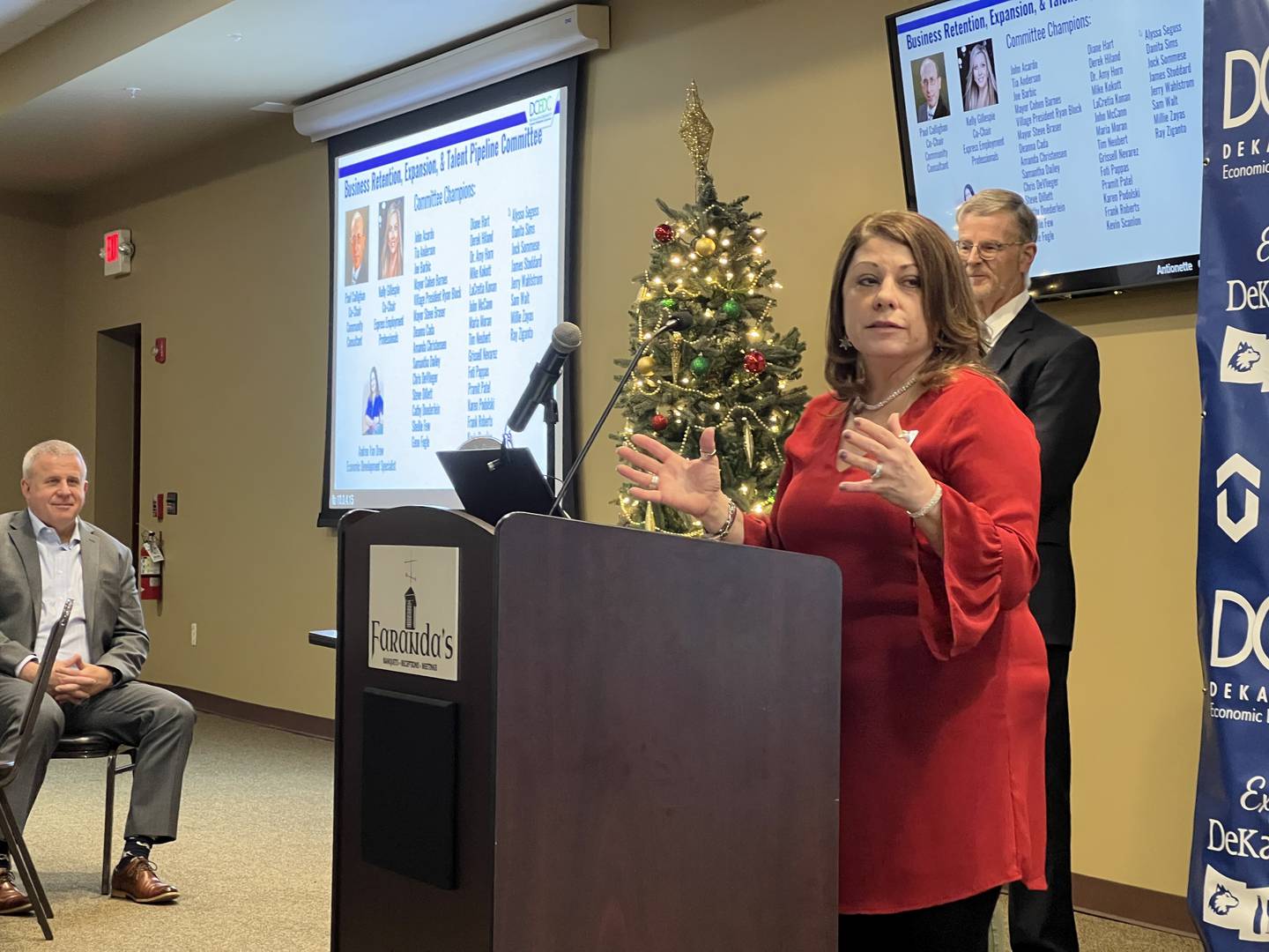 DeKalb Mayor Cohen Barnes and former DeKalb County Economic Development Corporation executive board president Michael Kokott listen to Courtney Strohacker present during the corporation's quarterly board meeting on Dec. 13, 2024.