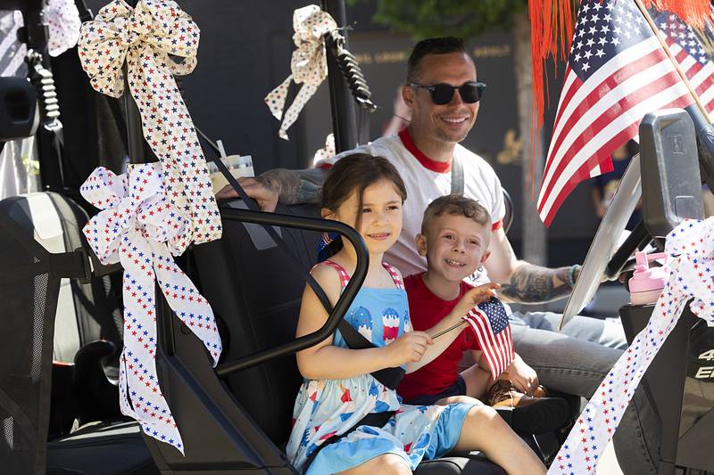 Paraders are decked out in red, white and blue Monday, May 25, 2026, as the procession makes its way to Oakwood Cemetery in Dixon.