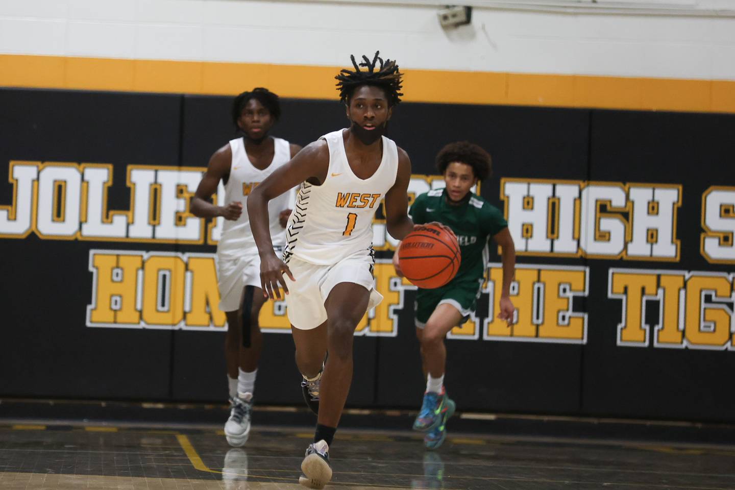 Joliet West’s Justus McNair takes the ball up court against Plainfield Central. Friday, Jan. 28, 2022 in Joliet.