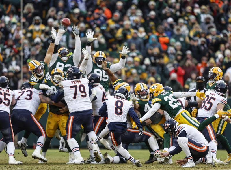 Chicago Bears place kicker Cairo Santos (8) kicks the game winning field goal during an NFL football game against the Green Bay Packers Sunday, Jan. 5, 2025, in Green Bay, Wis. (AP Photo/Jeffrey Phelps)