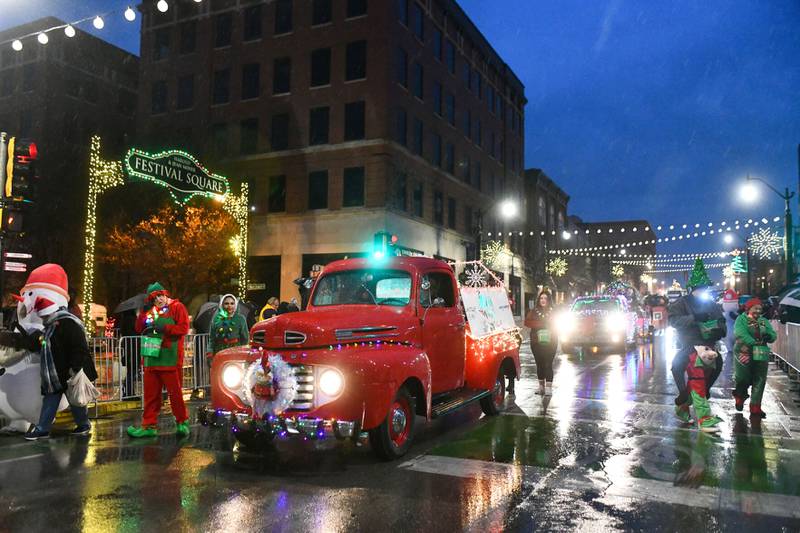 Lighted parade entries travel down South Schuyler Avenue on Saturday during the third annual Kankakee Christmas Parade.