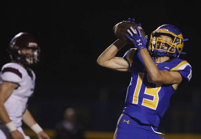 Johnsburg's Carter Block hauls in a AJ Bravieri pass during a Kishwaukee River Conference football game against Marengo on Friday, Sept. 15, 2023, at Johnsburg High School.
