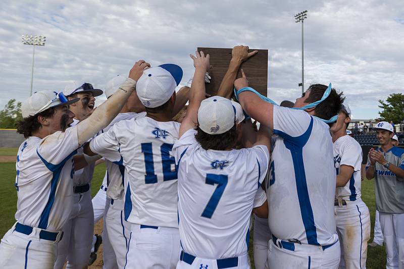 The Newman Comets baseball team celebrate their win over Chicago Hope Monday, May 27, 2024 during the Class 2A super-sectional in Rockford to advance to the state tournament.