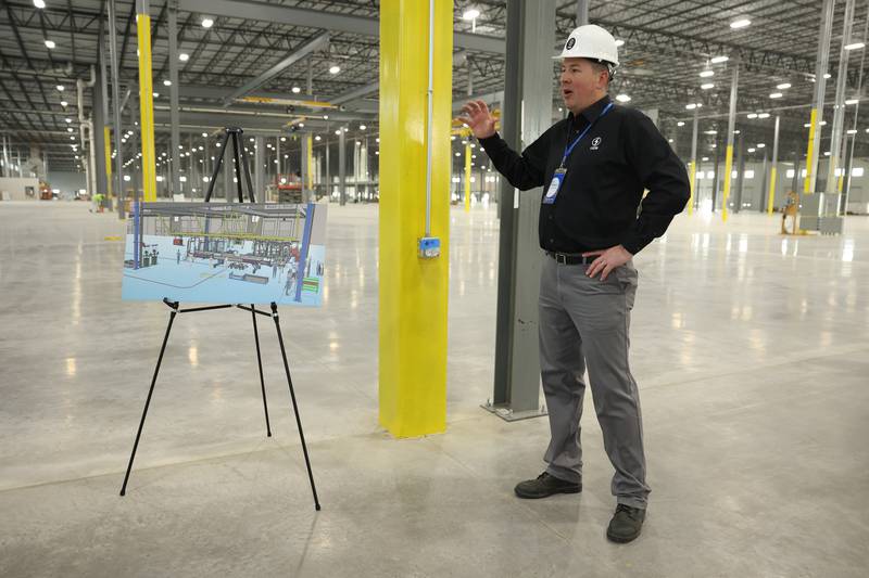 Lion Electric vehicle manufacturing facility General Manager Eric Pansegrau gives a tour during a press conference and interactive tour the new manufacturing facility.. Monday, Mar. 21, 2022, in Joliet.