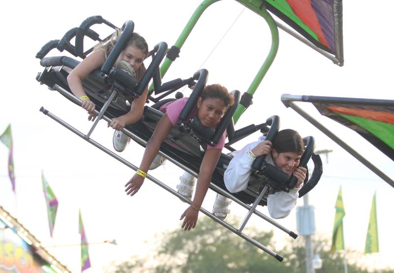Kids ride the "Cliffhanger" ride during the 168th annual Bureau County Fair on Saturday, Aug. 26 2023 in Princeton.