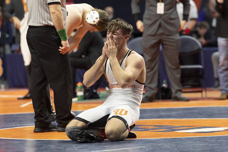 Washington’s Peyton Cox celebrates after beating IC Catholic’s Aiden Arnett in the 144 pound weight class of the 2A state individual wrestling finals Saturday, Feb. 22, 2025, at State Farm Center in Champaign.