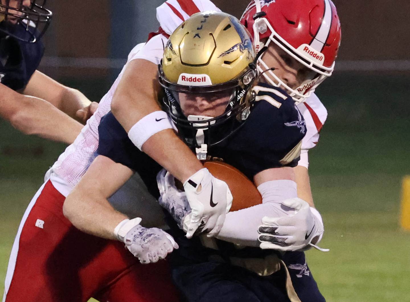 Hiawatha's Tommy Butler tries to get loose from a South Beloit defender during their game Friday, Sept. 20, 2024, at Hiawatha High School in Kirkland.