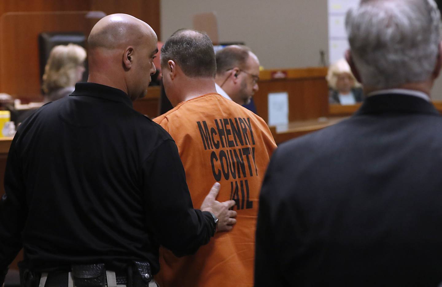 William Bishop is led out of court after being sentenced by McHenry County Judge Michael Coppedge on Thursday, Jan. 26, 2023, in the McHenry County courthouse in Woodstock.