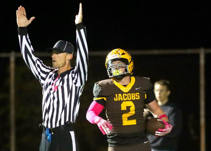 Jacobs’ Caden DuMelle lands in the end zone with a touchdown against Dundee-Crown in varsity football  at Jacobs High School in Algonquin on Friday, Oct. 10, 2025.