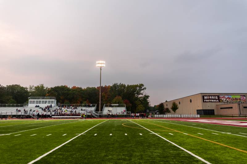 Fall colors frame Morris High School on the evening of Oct. 15, 2025.
