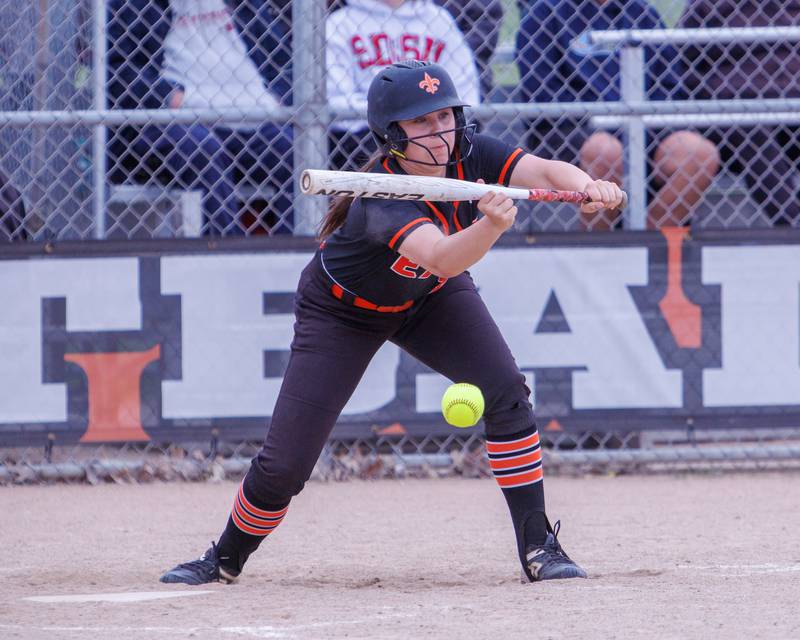 St. Charles East's Lexi Majkszak lays down a bunt for a hit against Schaumburg at the Class 4A St. Charles East Regional Final on Friday, May 22,2026 in St. Charles.