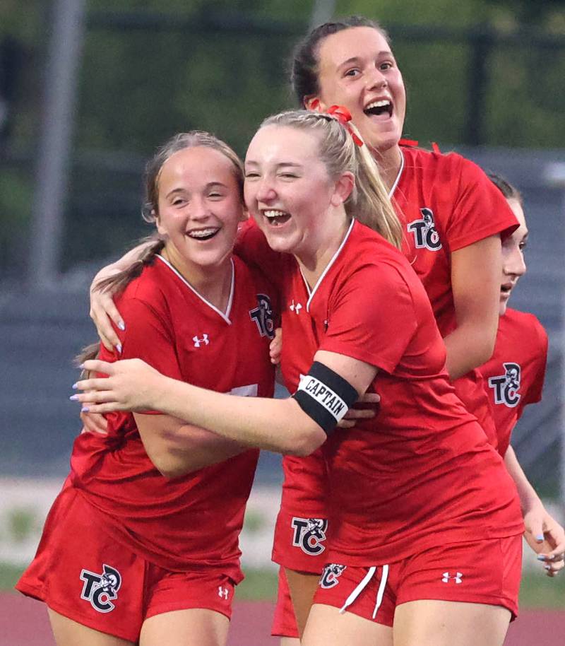 Timothy Christian's Lucy Wilgenburg (left) is hugged by her teammates after scoring to tie the game with Johnsburg Thursday, June 5, 2025, during their IHSA Class 1A state semifinal game at North Central College in Naperville.