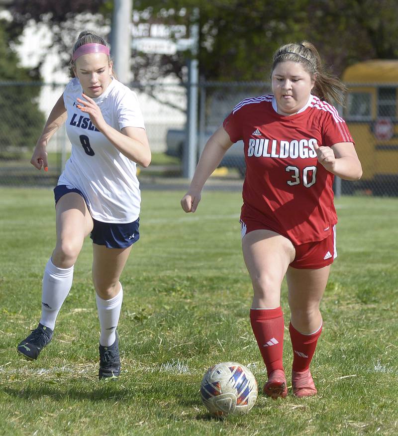 Streator’s Iliana Gomez and Lisle’s Ally Doering chase the the ball for control on Thursday April 25, 2024 at James Street Recreation Area in Streator.