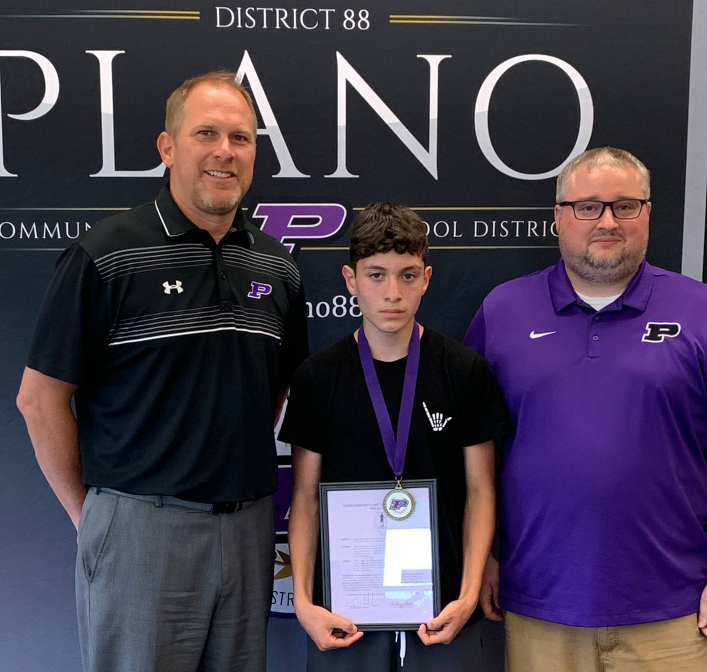 Pictured from left are Plano School District Superintendent Tony Baker, Johnny Espino and Plano Middle School assistant principal and athletic director Dan Solecki.