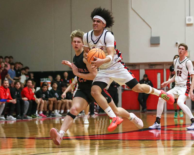 Benet's Jayden Wright (3) grabs a loose ball during their Class 4A Bolingbrook Sectional semifinal basketball game between Yorkville at Benet, March 3, 2026 in Bolingbrook.